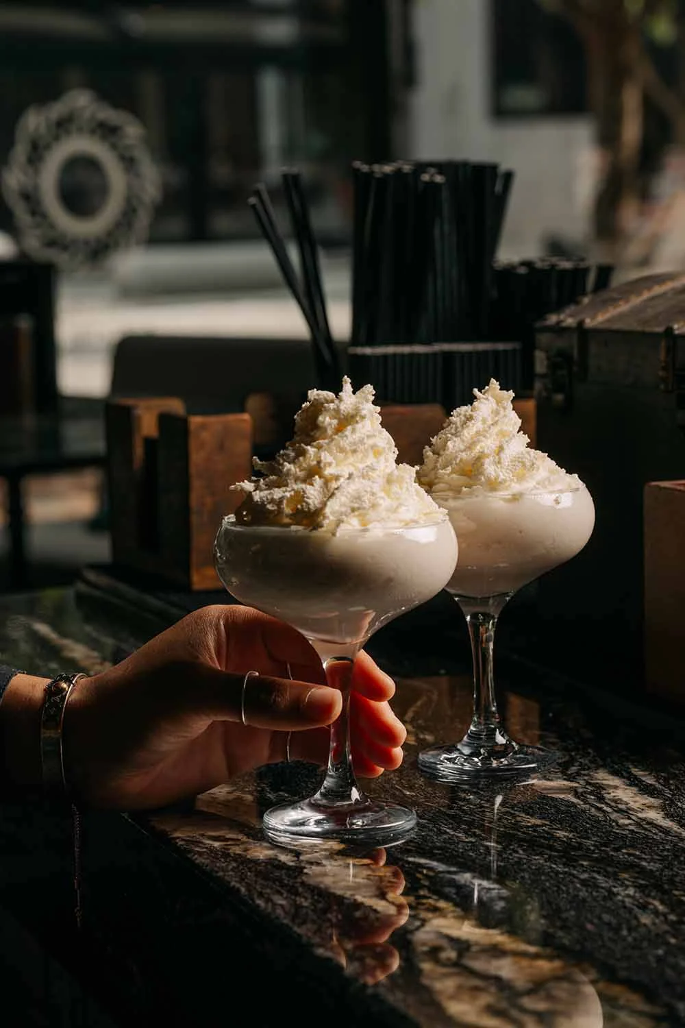 White Christmas cocktail with cream, chocolate and raspberry at Siamais